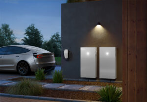 Home battery storage units beside electric car charging station